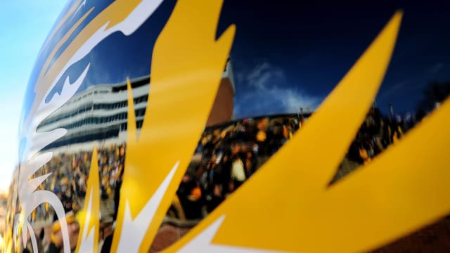 Faurot Field reflects in a golf cart decaled to match a Missouri Tigers helmet before the start of the game against the Kentucky Wildcats.