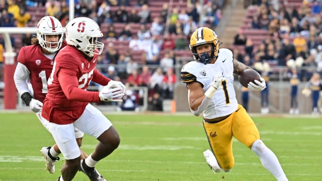 Nov 18, 2023; Stanford, California, USA; California Golden Bears running back Jaydn Ott (1) runs with the football against Stanford Cardinal linebacker David Bailey (23) during the first quarter at Stanford Stadium. Mandatory Credit: Robert Edwards-USA TODAY Sports
