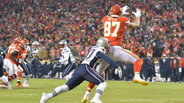 Jan 20, 2019; Kansas City, MO, USA; Kansas City Chiefs tight end Travis Kelce (87) catches a touchdown pass in front of New England Patriots defensive back J.C. Jackson (27) during the second half of the AFC Championship game at Arrowhead Stadium. Mandatory Credit: Denny Medley-USA TODAY Sports  