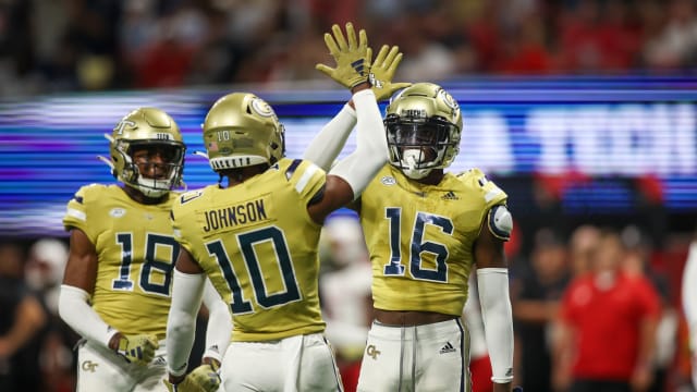 Sep 1, 2023; Atlanta, Georgia, USA; Georgia Tech Yellow Jackets defensive back K.J. Wallace (16) reacts after a pass breakup with defensive back Kenan Johnson (10) against the Louisville Cardinals in the first quarter at Mercedes-Benz Stadium. Mandatory Credit: Brett Davis-USA TODAY Sports 