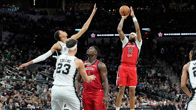 Dec 17, 2023; San Antonio, Texas, USA; New Orleans Pelicans Brandon Ingram (14) shoots over San Antonio Spurs forward Victor Wembanyama (1) during the first half at Frost Bank Center.