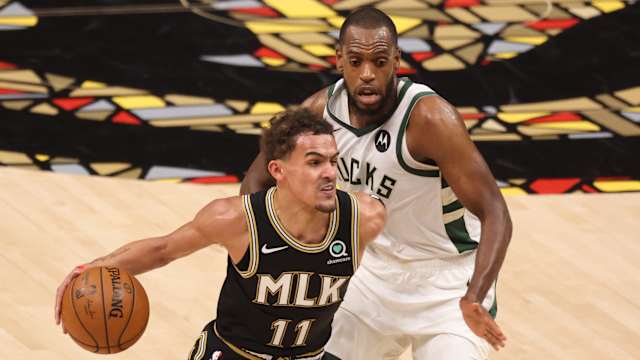 Atlanta Hawks guard Trae Young (11) drives against Milwaukee Bucks forward Khris Middleton (
