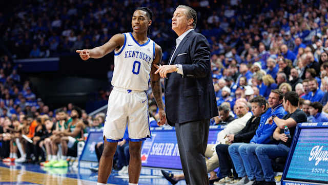 Nov 28, 2023; Lexington, Kentucky, USA; Kentucky Wildcats guard Rob Dillingham (0) talks with head coach John Calipari during the first half against the Miami (Fl) Hurricanes at Rupp Arena at Central Bank Center. Mandatory Credit: Jordan Prather-USA TODAY Sports