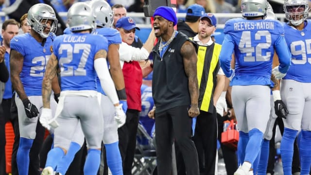 Detroit Lions safety C.J. Gardner-Johnson celebrates on the sidelines.