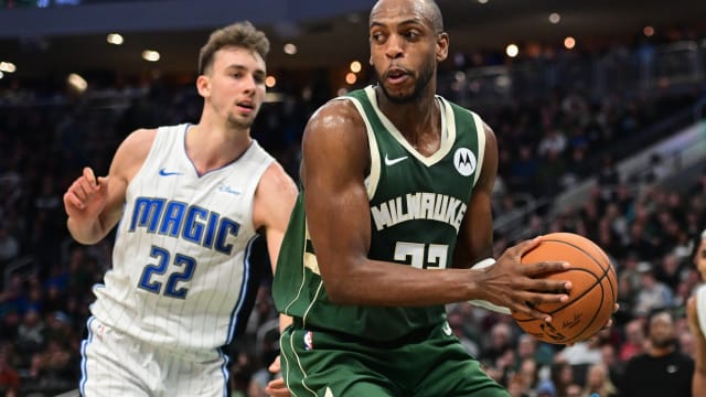 Milwaukee Bucks center Khris Middleton (22) looks for a shot against Orlando Magic forward Franz Wagner (22)