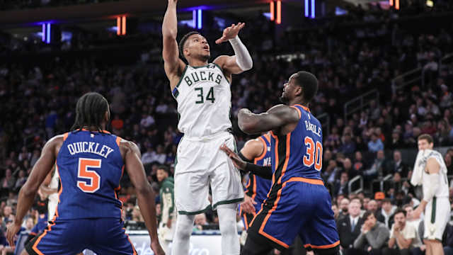 Milwaukee Bucks forward Giannis Antetokounmpo (34) shoots over New York Knicks forward Julius Randle (30) 