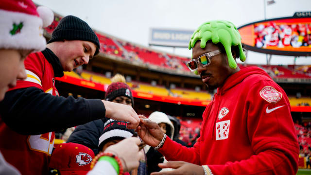 Dec 25, 2023; Kansas City, Missouri, USA; Kansas City Chiefs wide receiver Mecole Hardman Jr. (12) signs autographs prior to a game against the Las Vegas Raiders at GEHA Field at Arrowhead Stadium. Mandatory Credit: Jay Biggerstaff-USA TODAY Sports  