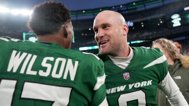 Jets' PK Greg Zuerlein and WR Garrett Wilson share a celebratory handshake after a game-winning 54-yard field goal