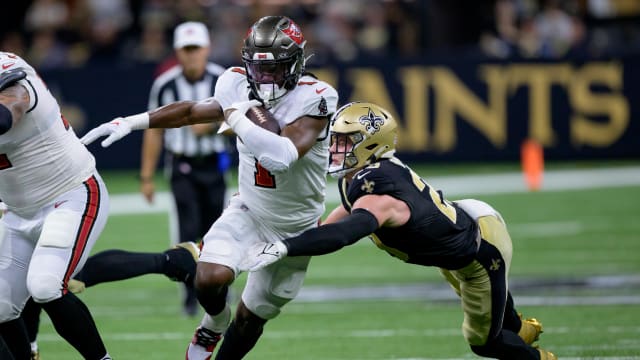 Oct 1, 2023; New Orleans, Louisiana, USA; Tampa Bay Buccaneers running back Rachaad White (1) runs against the New Orleans Saints during the second quarter at the Caesars Superdome. Mandatory Credit: Matthew Hinton-USA TODAY Sports