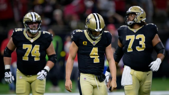 New Orleans Saints quarterback Derek Carr (4) reacts after being sacked and fumbling the ball against the Tampa Bay Buccaneers