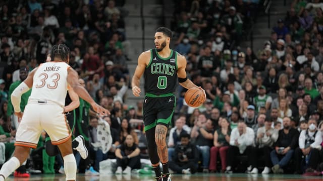 Dec 31, 2023; San Antonio, Texas, USA; Boston Celtics forward Jayson Tatum (0) dribbles the ball against San Antonio Spurs guard Tre Jones (33) in the first half at Frost Bank Center.
