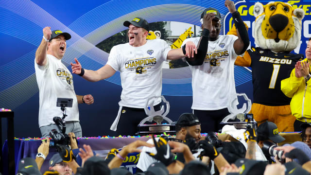 Dec 29, 2023; Arlington, TX, USA; Missouri Tigers head coach Eliah Drinkwitz and Missouri Tigers quarterback Brady Cook (12) and Missouri Tigers defensive lineman Johnny Walker Jr. (15) celebrate after the game against the Ohio State Buckeyes at AT&T Stadium.