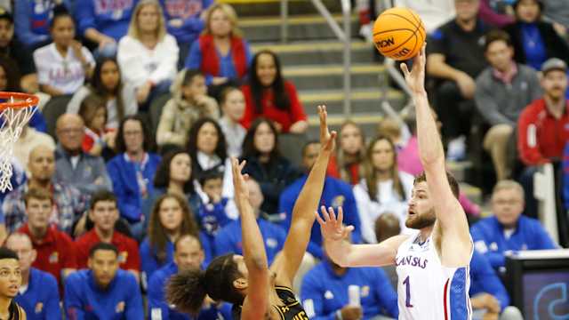 Kansas senior center Hunter Dickinson (1) shoots for two against Wichita State during the second half of Saturday's game inside T-Mobile Center in Kansas City.