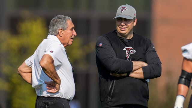 Jul 29, 2021; Flowery Branch, GA, USA; Atlanta Falcons team owner Arthur Blank (left) talks with head coach Arthur Smith on the field during the first day of training camp at the Atlanta Falcons Training Facility.