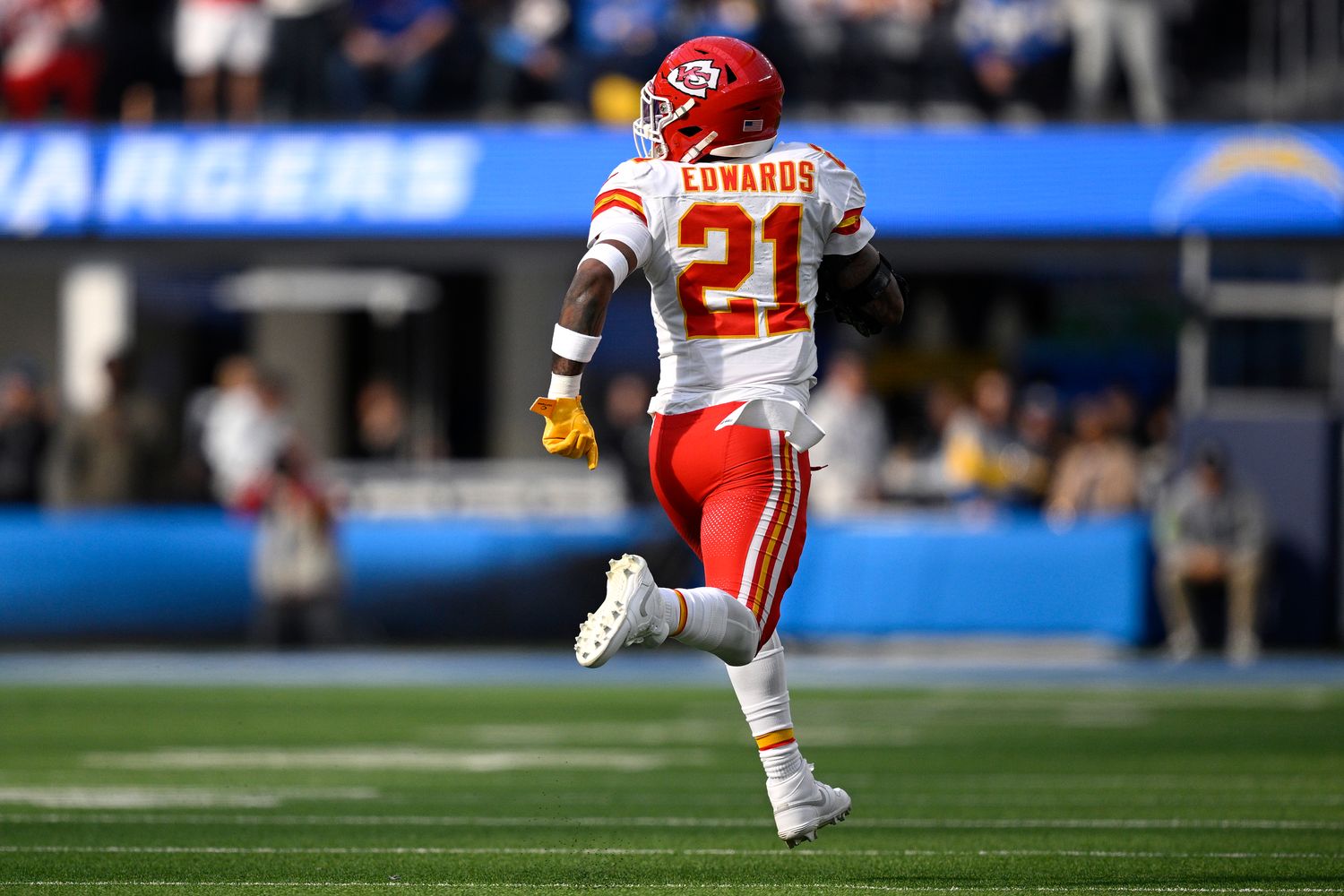Jan 7, 2024; Inglewood, California, USA; Kansas City Chiefs safety Mike Edwards (21) returns a fumble for a touchdown during the first half against the Los Angeles Chargers at SoFi Stadium. Mandatory Credit: Orlando Ramirez-USA TODAY Sports  