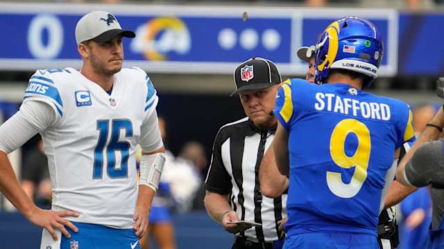 Detroit Lions quarterback Jared Goff and Los Angeles Rams quarterback Matthew Stafford meet at mid field.