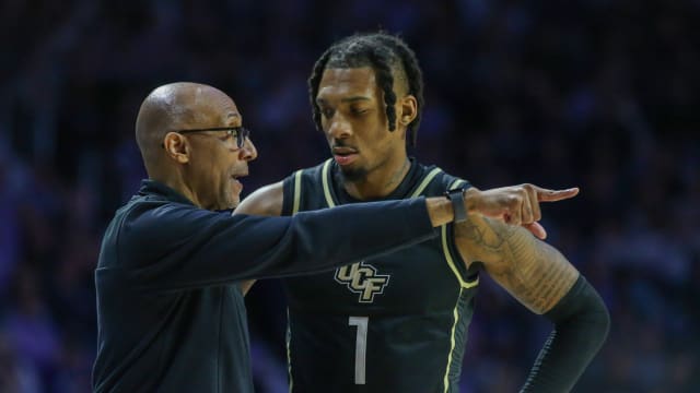 Jan 6, 2024; Manhattan, Kansas, USA; UCF Knights head coach Johnny Dawkins talks to guard Antwann Jones (1) during the second half Kansas State Wildcats at Bramlage Coliseum. Mandatory Credit: Scott Sewell-USA TODAY Sports  