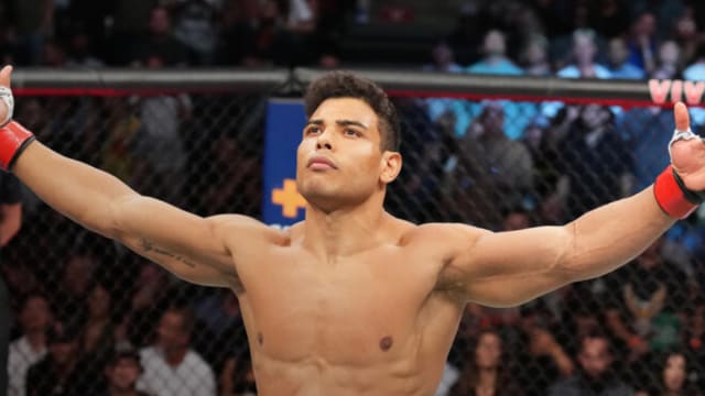 Paulo Costa poses inside the Octagon for a UFC fight.
