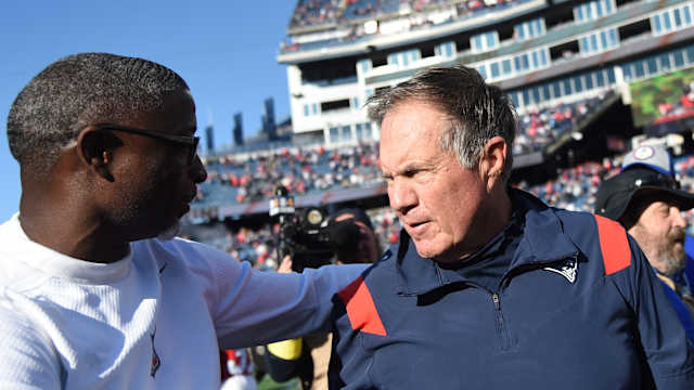 Oct 9, 2022; Foxborough, Massachusetts, USA; New England Patriots head coach Bill Belichick and Detroit Lions defensive coordinator Aaron Glenn meet at midfield at Gillette Stadium.