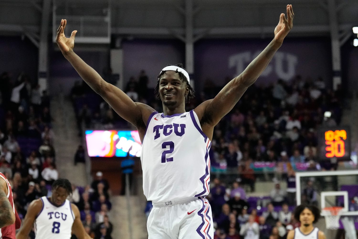 Jan 10, 2024; Fort Worth, Texas, USA; TCU Horned Frogs forward Emanuel Miller (2) reacts after scoring a three point basket against the Oklahoma Sooners during the second half at Ed and Rae Schollmaier Arena.