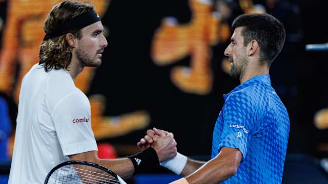 Novak Djokovic shakes hands with Stefanos Tsitsipas.