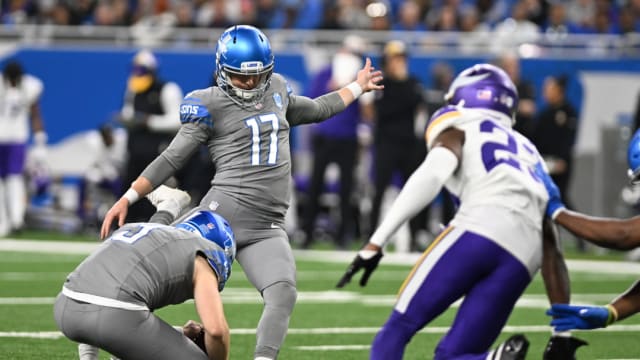 Detroit Lions kicker Michael Badgley kicks an extra point against the Minnesota Vikings.