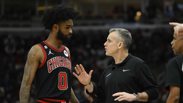 Chicago Bulls guard Coby White (0) talks with head coach Billy Donovan during the first half at the United Center. 