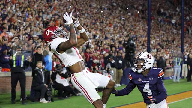 ov 25, 2023; Auburn, Alabama, USA; Alabama Crimson Tide wide receiver Isaiah Bond (17) scores the game winning touchdown over Auburn Tigers cornerback D.J. James (4) during the fourth quarter at Jordan-Hare Stadium. Mandatory Credit: John Reed-USA TODAY Sports