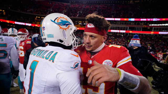 Jan 13, 2024; Kansas City, Missouri, USA; Kansas City Chiefs quarterback Patrick Mahomes (15) meets with Miami Dolphins quarterback Tua Tagovailoa (1) following the 2024 AFC wild card game at GEHA Field at Arrowhead Stadium. Mandatory Credit: Jay Biggerstaff-USA TODAY Sports  