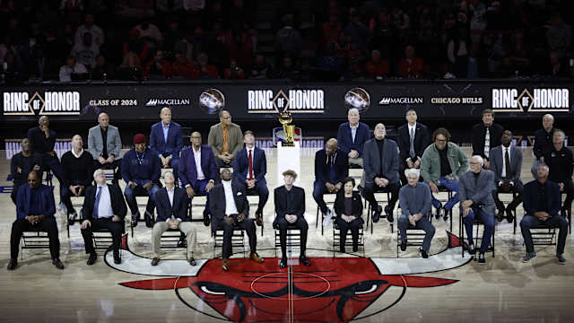 Chicago Bulls class of 2024 Ring of Honor inductees from left to right, (Back Row) Jim Cleamons, Erik Heiland, Ivika Duran, Clarence Gaines, Jr., John Ligmanowski, Chip Schaefer, Jim Stack, Al Vermeil (Middle Row) Randy Brown, Jud Buechler, Jason Coffey, James Edwards, Jack Haley, Jr., Ron Harper, Bill Wennington, Luc Longley, John Salley, Steve Kerr (Front Row) Artis Gilmore, Matt Kerr, Greg Klein, Bob Love, JJ Parrish, Thelma Krause, Chris Winter, Phil Jackson, Toni Kukoc are honored during the inaugural ceremony at halftime of a game between the Bulls and Golden State Warriors at United Center.