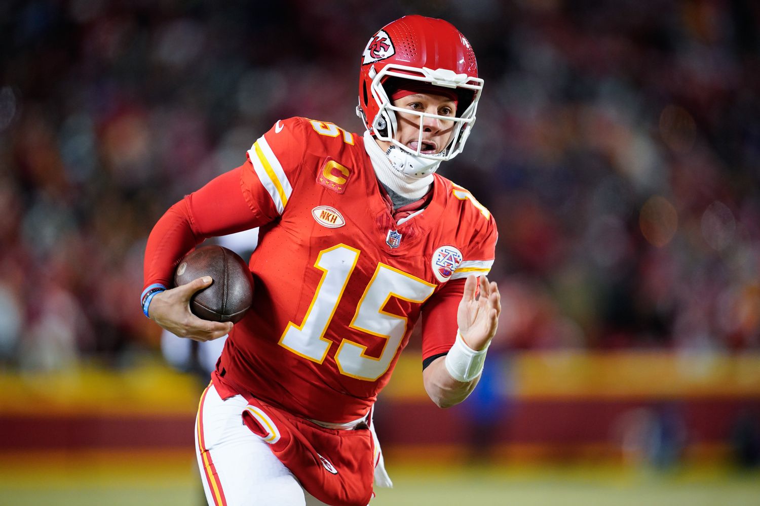 Jan 13, 2024; Kansas City, Missouri, USA; Kansas City Chiefs quarterback Patrick Mahomes (15) runs the ball against the Miami Dolphins during the first half of the 2024 AFC wild card game at GEHA Field at Arrowhead Stadium. Mandatory Credit: Jay Biggerstaff-USA TODAY Sports  