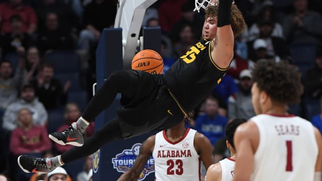 Mar 11, 2023; Nashville, TN, USA; Missouri Tigers forward Noah Carter (35) dunks the ball during the first half against the Alabama Crimson Tide at Bridgestone Arena. Mandatory Credit: Christopher Hanewinckel-USA TODAY Sports