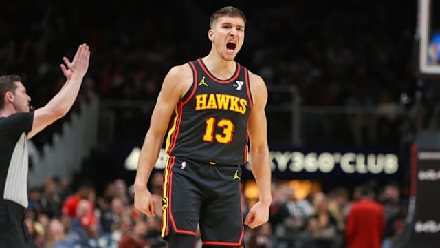 Dec 11, 2023; Atlanta, Georgia, USA; Atlanta Hawks guard Bogdan Bogdanovic (13) reacts after a basket against the Denver Nuggets in the second half at State Farm Arena.