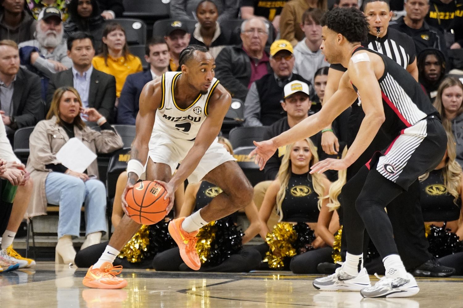 Jan 6, 2024; Columbia, Missouri, USA; Missouri Tigers guard Tamar Bates (2) dribbles the ball as Georgia Bulldogs guard Jabri Abdur-Rahim (1) defends during the second half at Mizzou Arena. 
