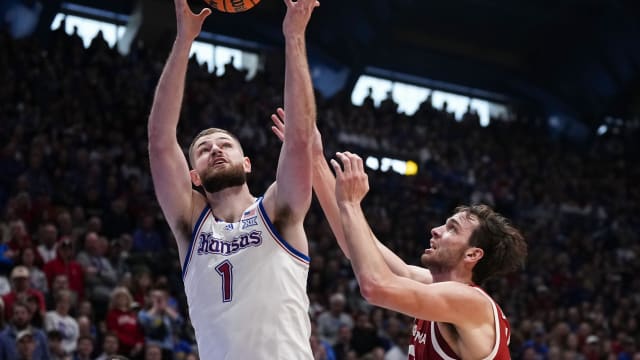 Kansas Jayhawks center Hunter Dickinson (1) rebounds against Oklahoma Sooners forward Sam Godwin (10) during the first half at Allen Fieldhouse.