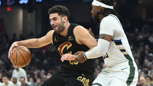 Cleveland Cavaliers forward Georges Niang (20) drives to the basket against Milwaukee Bucks forward Jae Crowder (99)