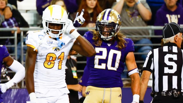Sep 3, 2022; Seattle, Washington, USA; Washington Huskies safety Asa Turner (20) celebrates after intercepting a pass against Kent State Golden Flashes wide receiver Devontez Walker (81) during the third quarter at Alaska Airlines Field at Husky Stadium. Mandatory Credit: Joe Nicholson-USA TODAY Sports