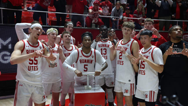 Caption: Jan 21, 2024; Salt Lake City, Utah, USA; Utah Utes guard Deivon Smith (5) Lights the U on the mountain outside of the Jon M. Huntsman Center after defeating the Oregon Ducks. Mandatory Credit: Rob Gray-USA TODAY Sports