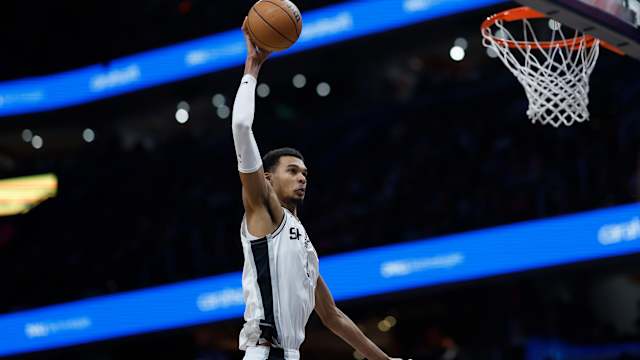 Jan 20, 2024; Washington, District of Columbia, USA; San Antonio Spurs center Victor Wembanyama (1) dunks the ball over Washington Wizards forward Marvin Bagley III (35) prior to being called for an offensive foul in the second half at Capital One Arena.
