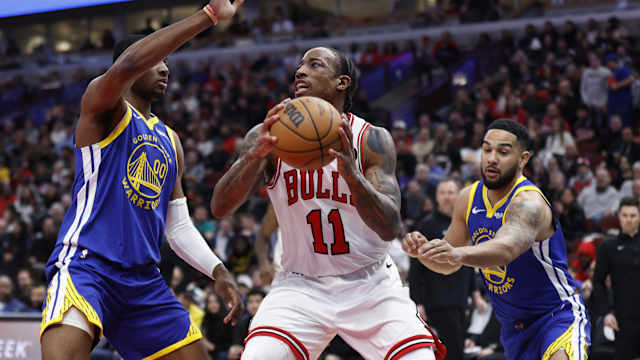 Chicago Bulls forward DeMar DeRozan (11) drives against Golden State Warriors forward Jonathan Kuminga (00) during the second half at United Center. 