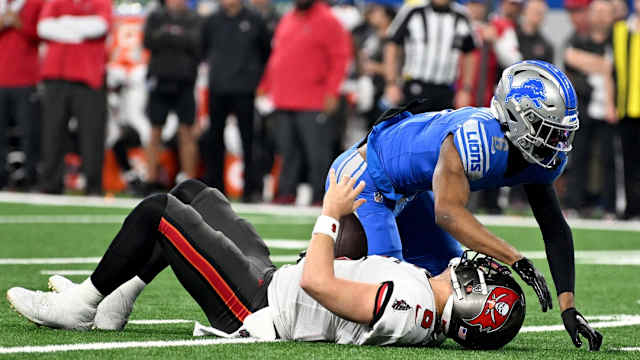 Detroit Lions safety Ifeatu Melifonwu sacks Baker Mayfield.