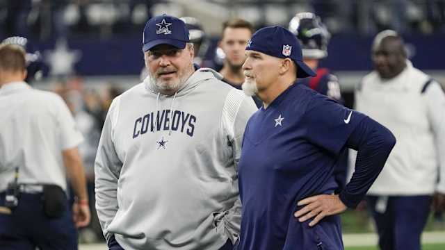Dec 11, 2022; Arlington, Texas, USA; Dallas Cowboys head coach Mike McCarthy and defensive coordinator Dan Quinn talk at midfield prior to a game against the Houston Texans at AT&T Stadium.