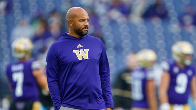 Oct 16, 2021; Seattle, Washington, USA; Washington Huskies head coach Jimmy Lake watches pregame warmups against the UCLA Bruins at Alaska Airlines Field at Husky Stadium.
