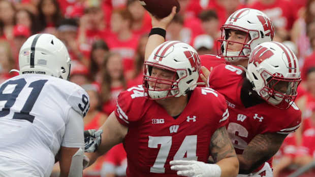 Wisconsin offensive lineman Michael Furtney (No. 74) blocking against Penn State (Credit: Mark Hoffman-USA TODAY Sports)