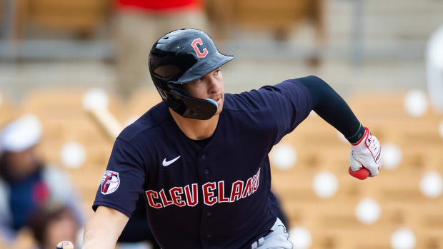 Mar 1, 2023; Phoenix, Arizona, USA; Cleveland Guardians outfielder Will Brennan hits a double against the Chicago White Sox during a spring training game at Camelback Ranch-Glendale. Mandatory Credit: Mark J. Rebilas-USA TODAY Sports