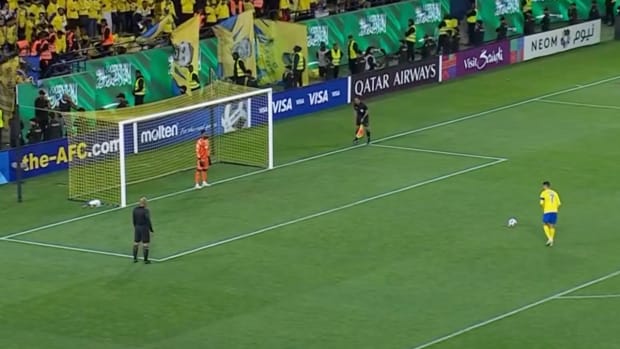 Cristiano Ronaldo pictured (right) moments before he converted a penalty kick for Al Nassr in a losing cause against Al Ain in the AFC Champions League's round of 16 in March 2024
