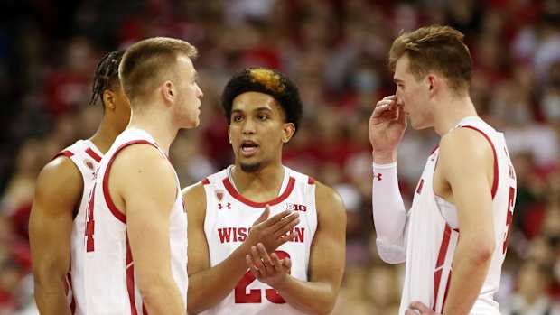 Point guard Chucky Hepburn talks with teammates against Nebraska.