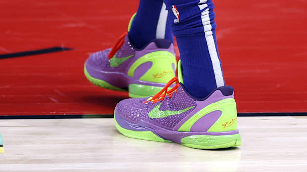 Philadelphia 76ers forward Tobias Harris' purple and green Nike Kobe sneakers.