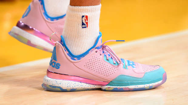View pink and blue adidas shoes.