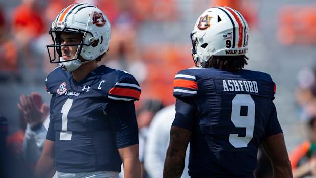 Auburn Tigers quarterback Payton Thorne (1) and quarterback Robby Ashford (9) warm up before Auburn Tigers take on Georgia Bulldogs at Jordan-Hare Stadium in Auburn, Ala., on Saturday, Sept. 30, 2023.